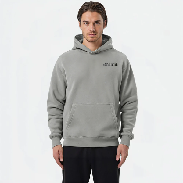 Sweat à capuche gris clair TOURISMO porté par homme, fond neutre blanc