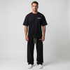 T-shirt noir oversize Tourismo Clothing porté en full look avec jogging assorti